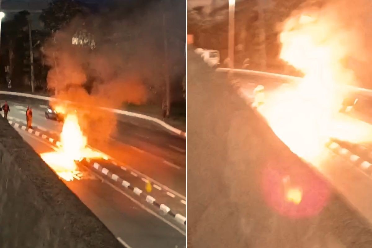 Moto pega fogo e explode no meio de avenida na área portuária de Santos; VÍDEO